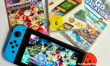 Foto von der Gamingkonsole Switch mit drei Switch Spielen
